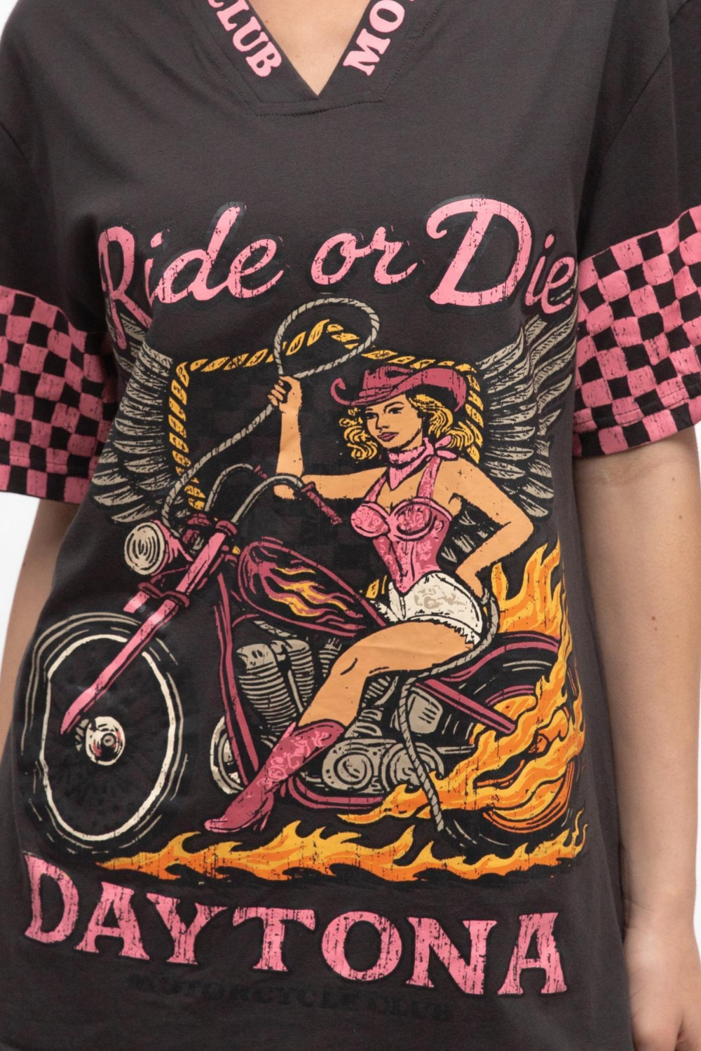 Black t-shirt with a graphic design of a woman on a motorcycle, flames, and text 'Ride or Die Daytona'.