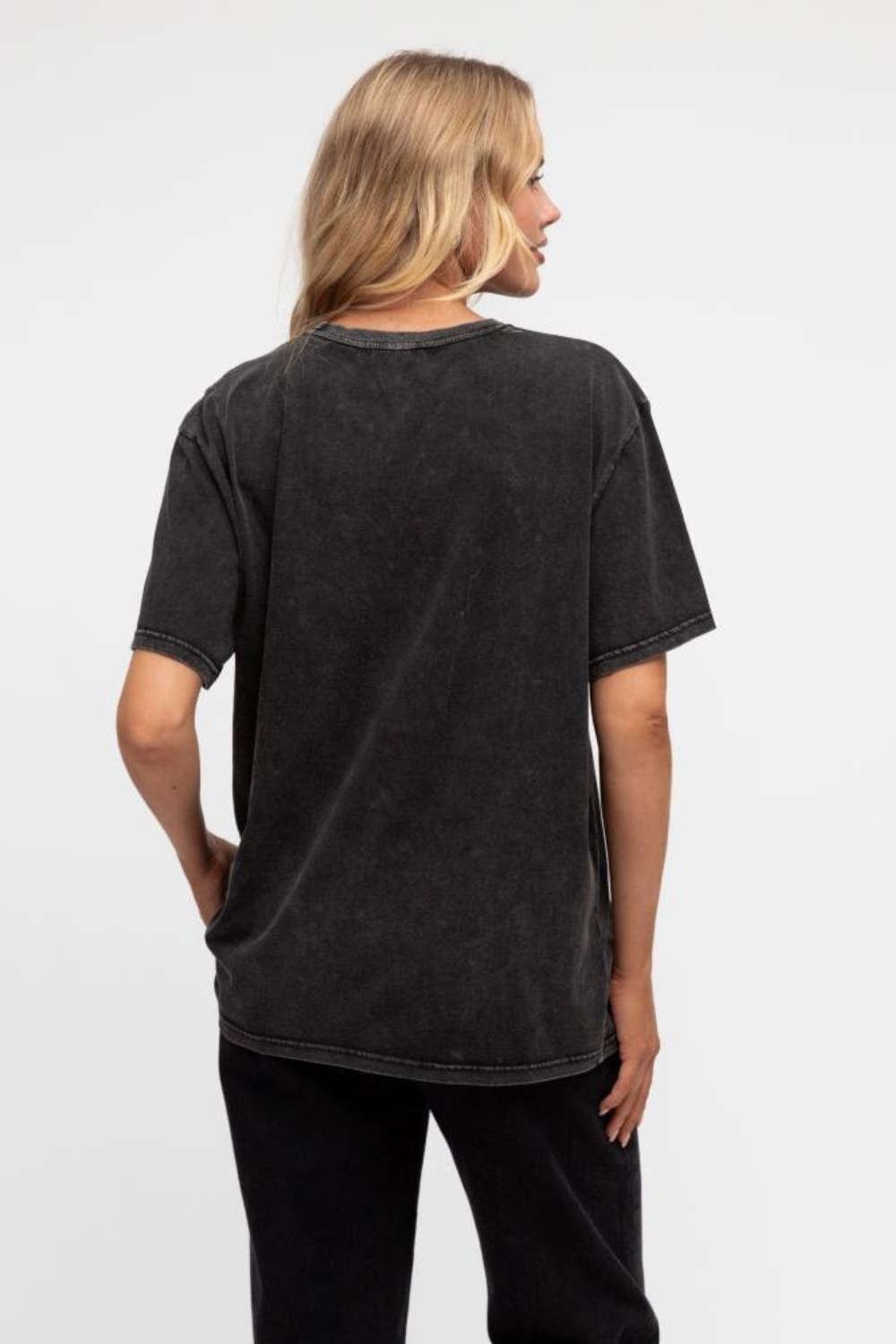 Person wearing a black t-shirt on a white background